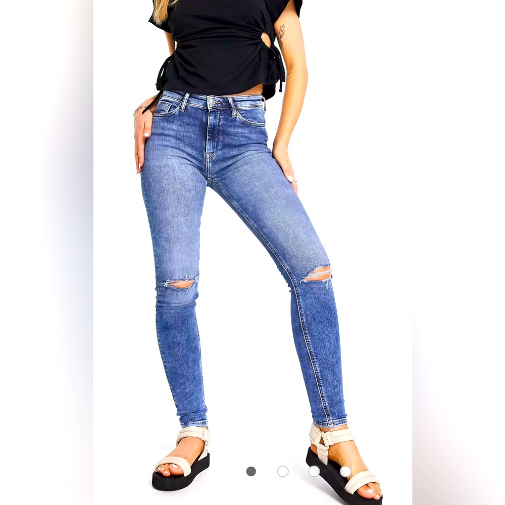 High rise jeans with distressed knees